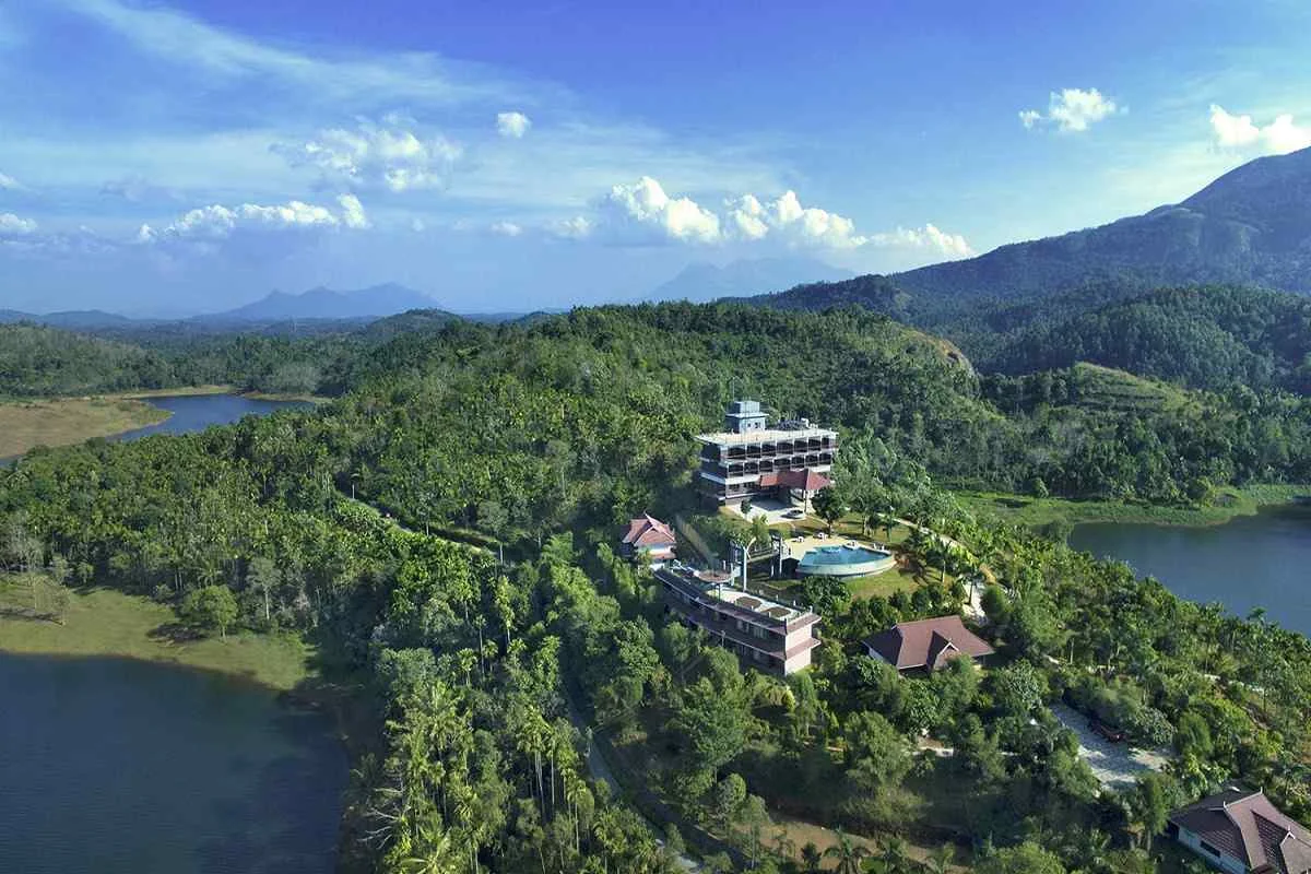 Lush green resort pathways, gardens and manicured lawns at Arayal Resorts